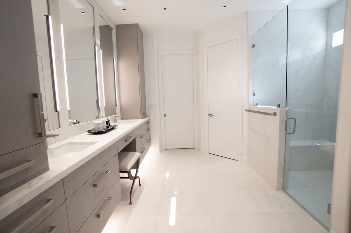 Modern bathroom featuring a spacious shower with marble accents, part of a Phoenix remodel by MGD Builders