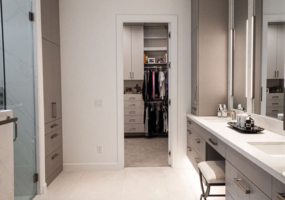 Modern vanity with backlit mirrors and custom cabinetry, part of a bathroom remodel by MGD Builders in Phoenix, AZ