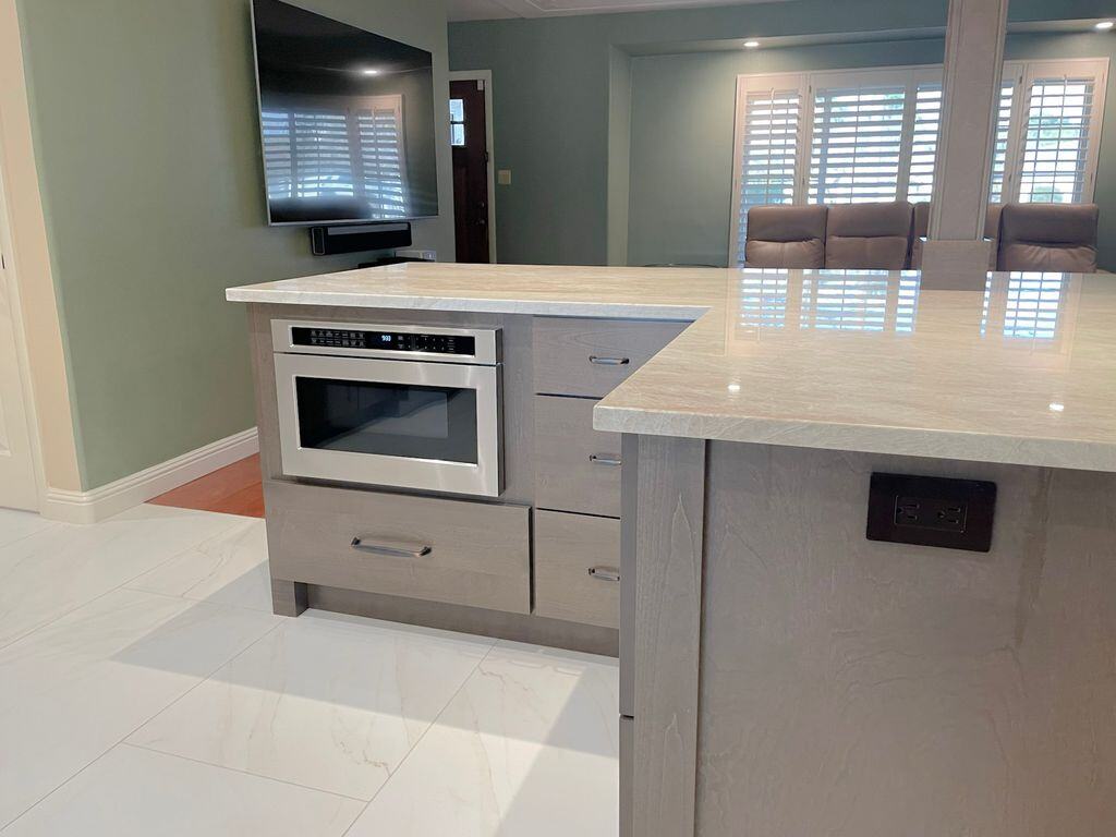 Kitchen island with built-in microwave, part of a Phoenix remodel by MGD Builders