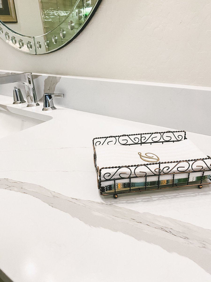 Close-up of bathroom countertop and sink with decorative tray, part of a Phoenix, AZ remodel by MGD Builders