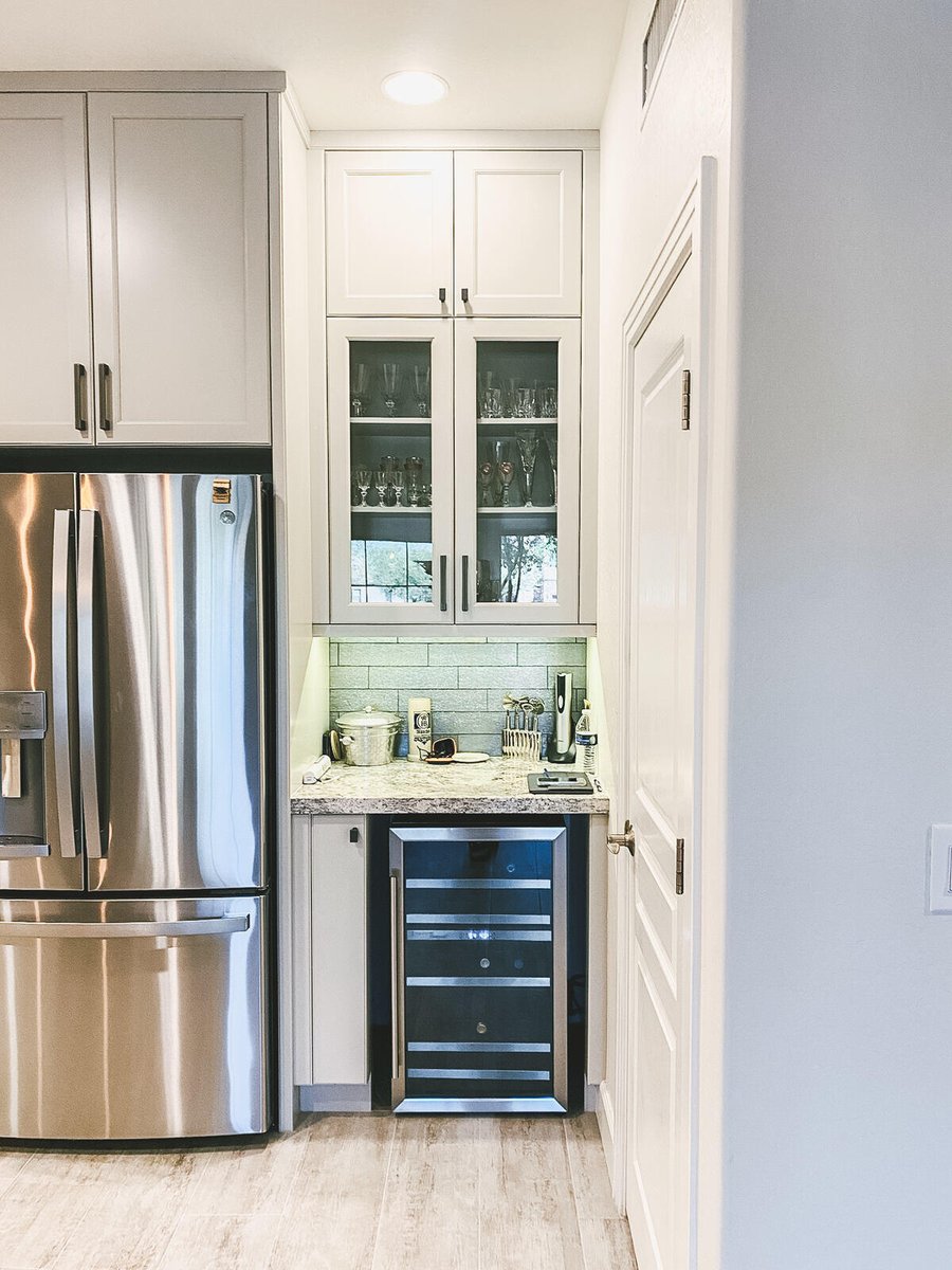 Stainless steel fridge and wine cooler in remodeled kitchen by MGD Builders in Phoenix, AZ