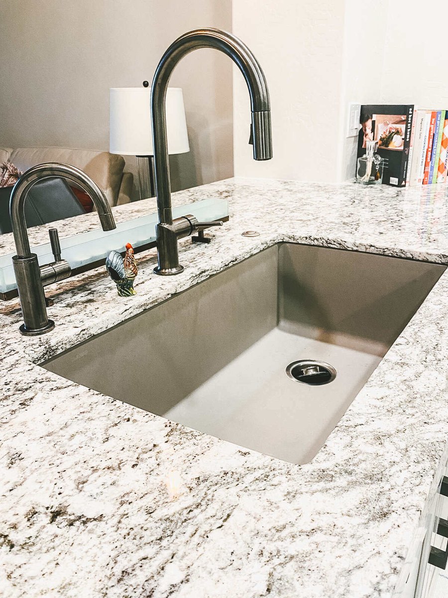 Stainless steel kitchen sink with granite countertop during kitchen remodel by MGD Builders in Phoenix, AZ