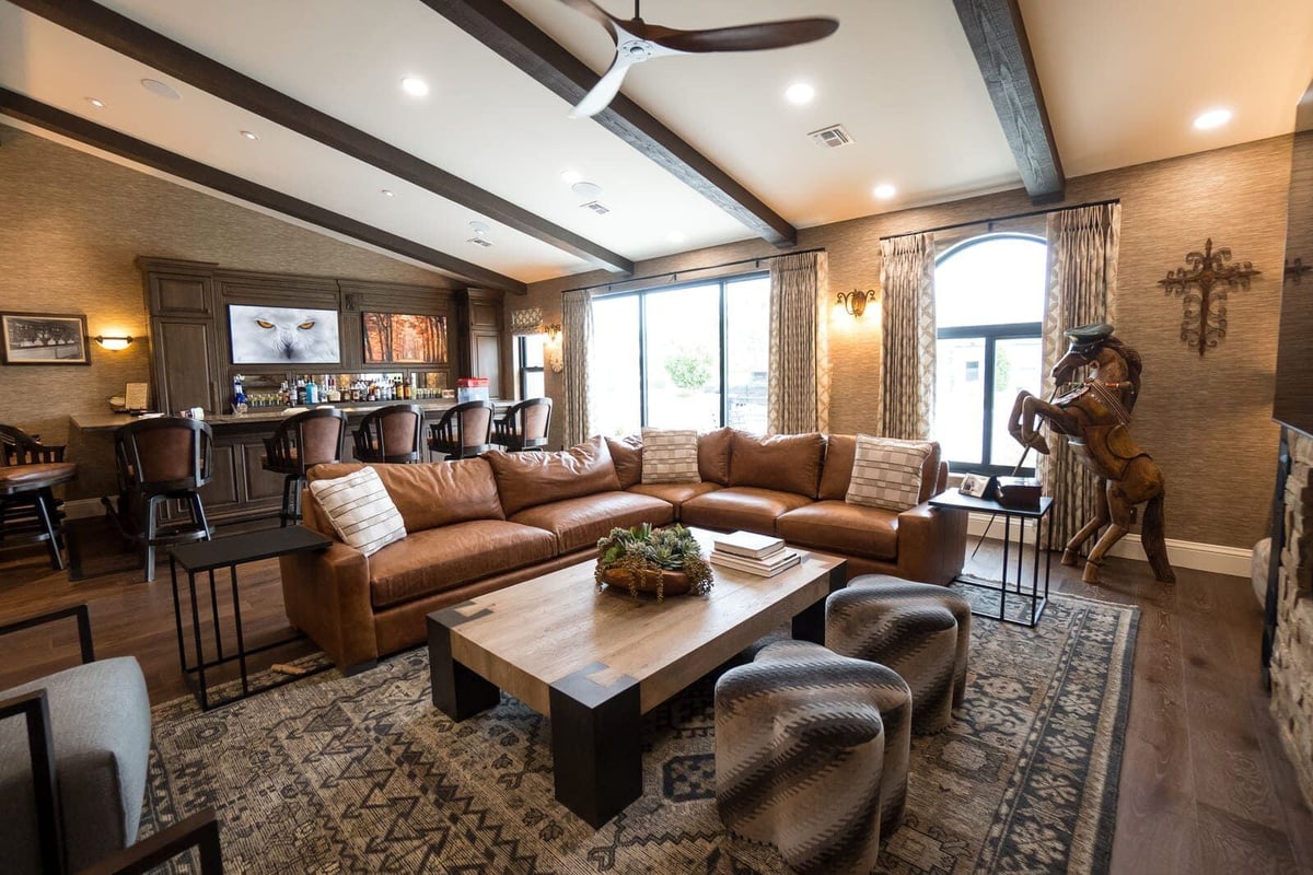 Comfortable living room with sectional sofa and built-in bar, part of a Phoenix home renovation by MGD Builders 