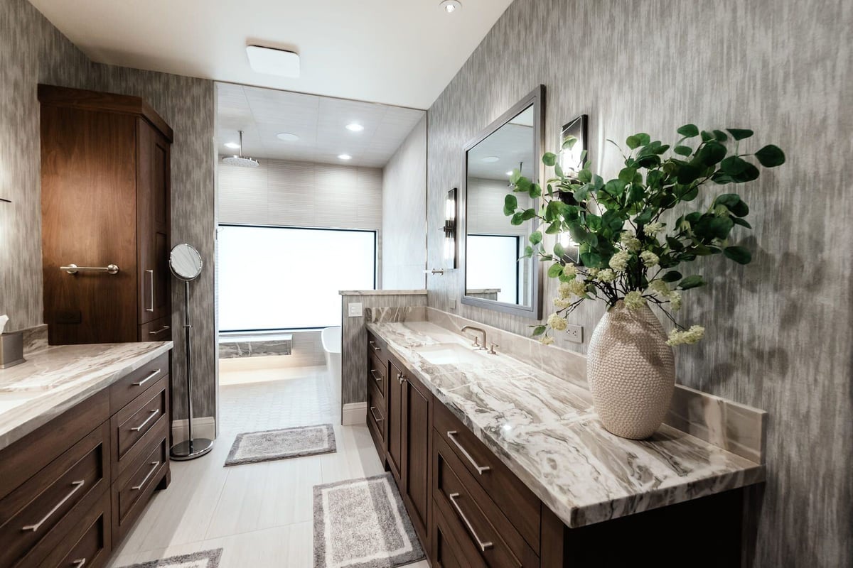 Custom bathroom design featuring dual vanities and elegant wood cabinetry in Phoenix by MGD Builders 