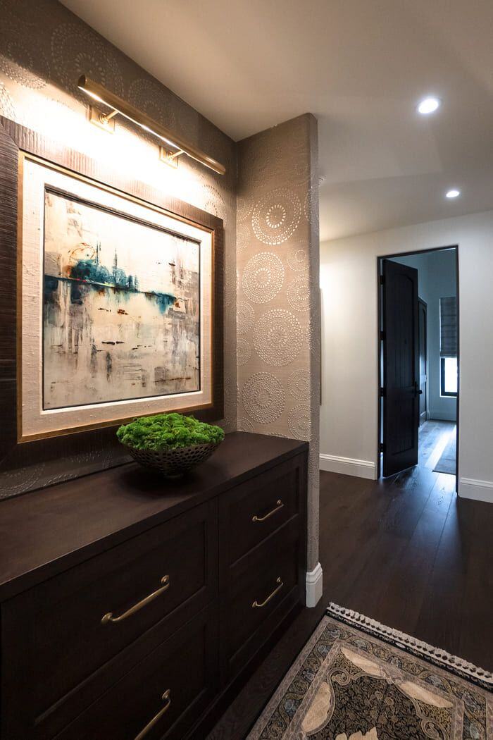 Custom hallway design with artistic touches in Phoenix home remodel by MGD Builders 