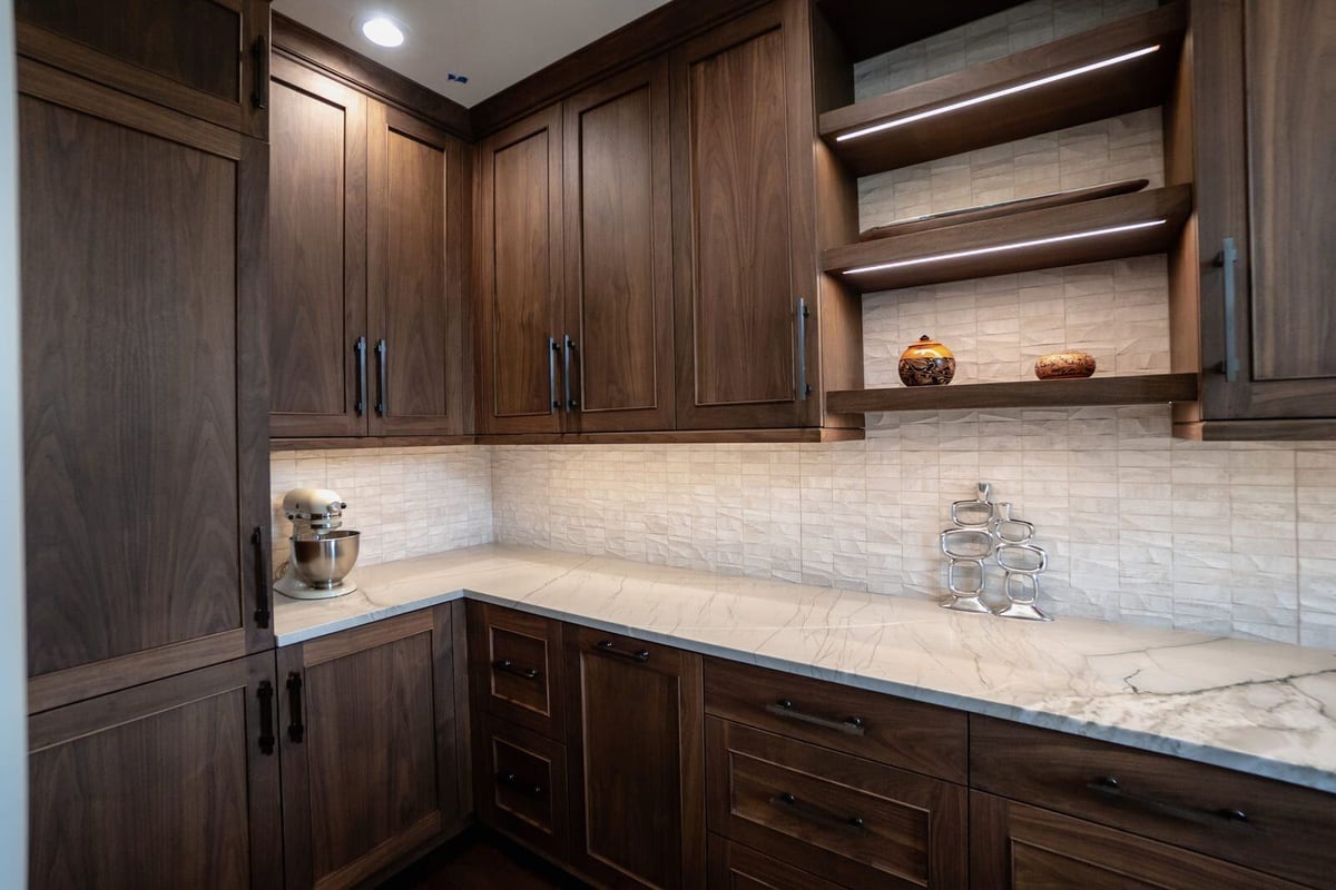 Custom kitchen with wood cabinetry and marble countertops designed by MGD Builders in Phoenix 