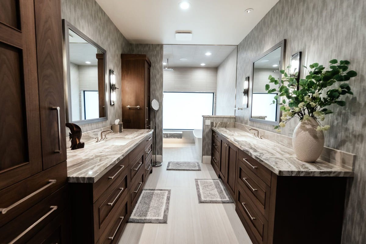 Elegant bathroom with custom wood cabinetry and marble countertops, Phoenix renovation by MGD Builders 