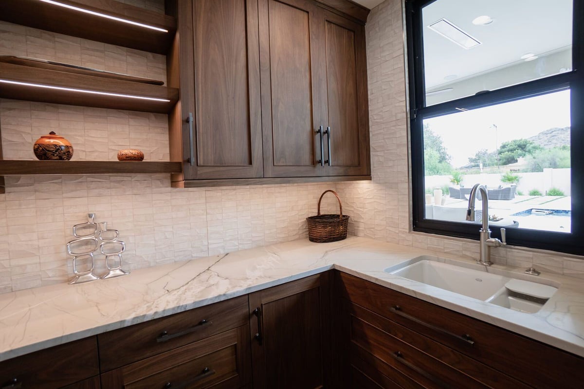 Elegant kitchen design with open shelving and marble countertops, MGD Builders renovation in Phoenix 