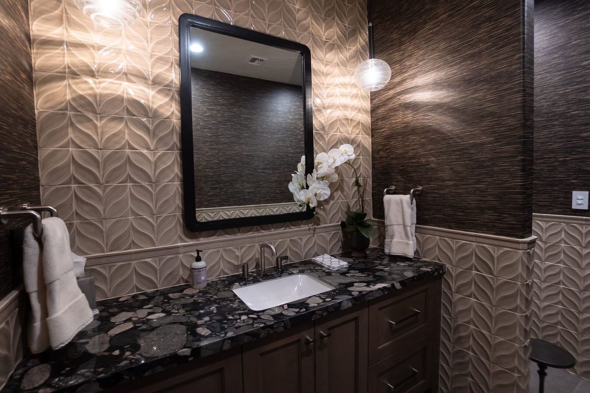 Luxurious bathroom renovation featuring a custom sink and patterned wall tiles, MGD Builders, Phoenix AZ 