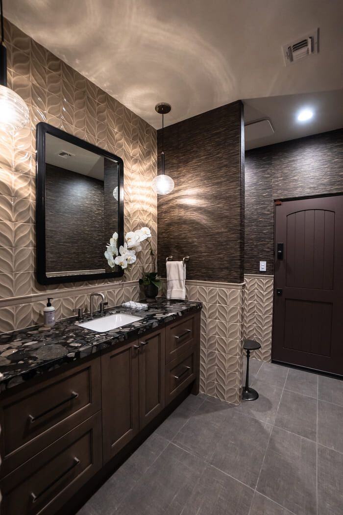 Luxurious bathroom renovation with black countertop and intricate tile walls, MGD Builders, Phoenix AZ 