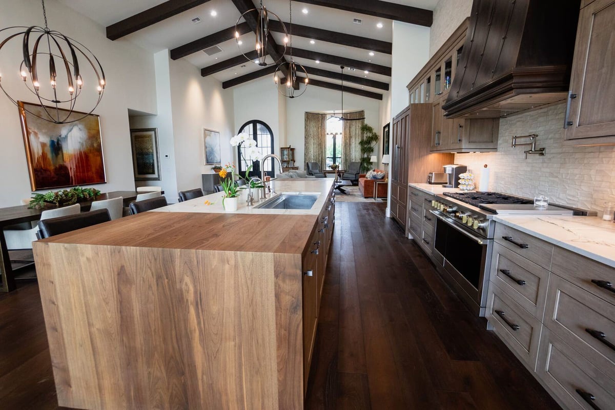 Marble kitchen island with flowers and modern lighting, Mertel Whole Home Renovation, MGD Builders, Phoenix AZ 