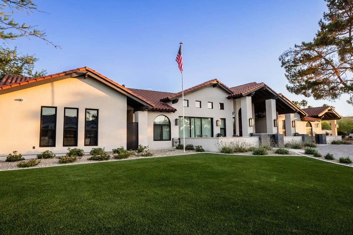 Mertel whole home renovation by MGD Builders in Phoenix, AZ with a modern exterior and lush landscaping 