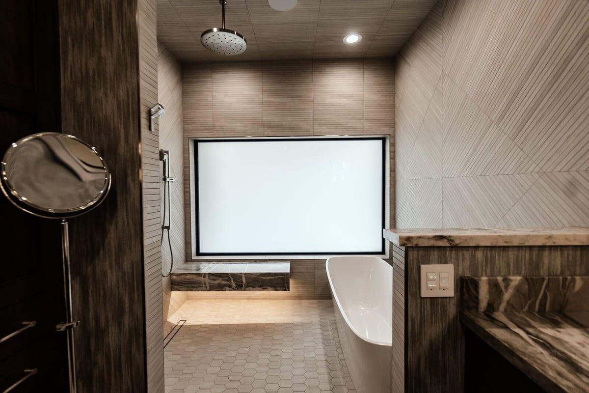 Modern Phoenix bathroom with a walk-in shower and soaking tub by MGD Builders 