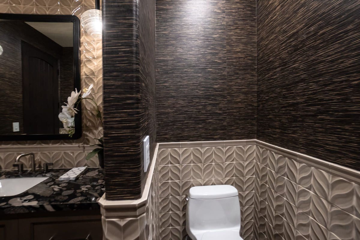 Modern bathroom featuring white toilet and patterned wall tiles, MGD Builders, Phoenix AZ 