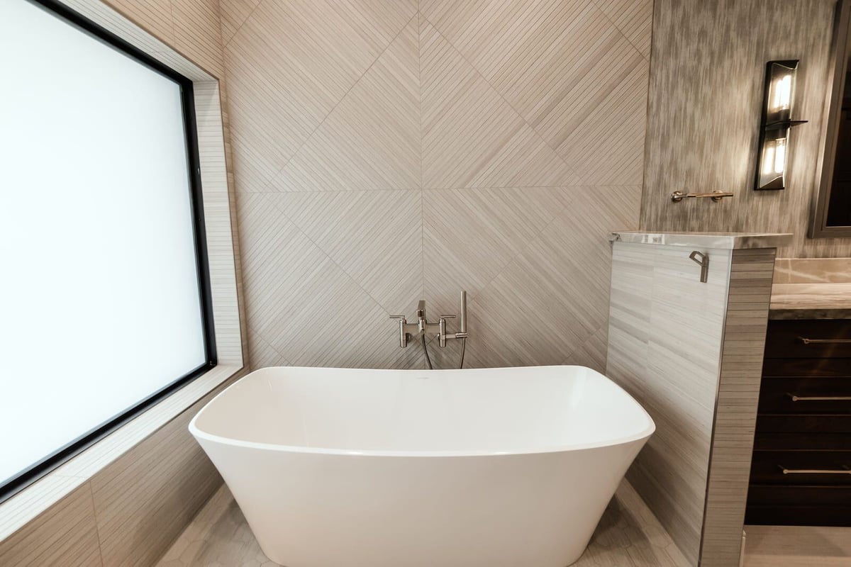 Modern bathroom renovation featuring a freestanding tub and custom shower design, Phoenix by MGD Builders 