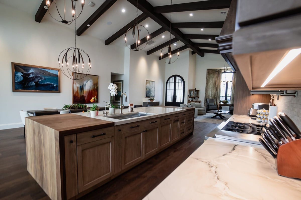 Modern kitchen with large island and view of outdoor patio, Mertel Whole Home Renovation, MGD Builders, Phoenix AZ 