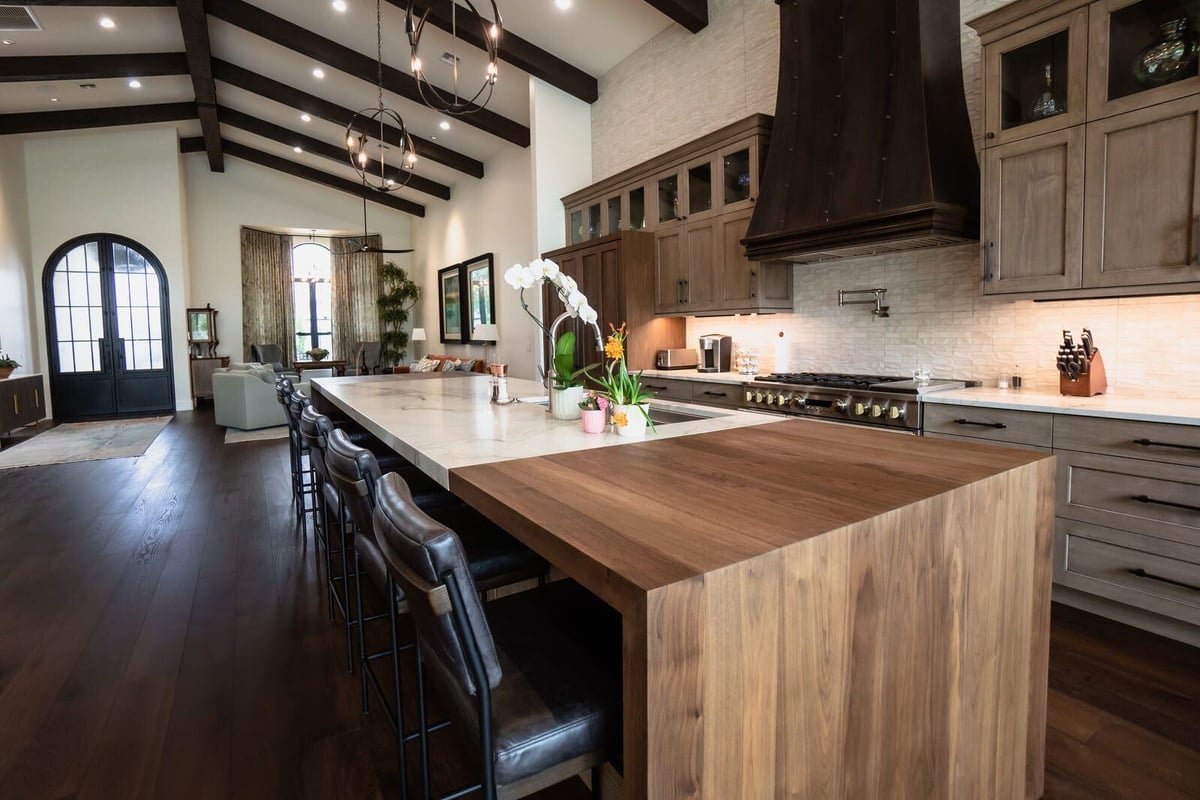 Open kitchen with large island and wooden cabinetry under vaulted ceiling, Mertel Whole Home Renovation, MGD Builders, Phoenix AZ 