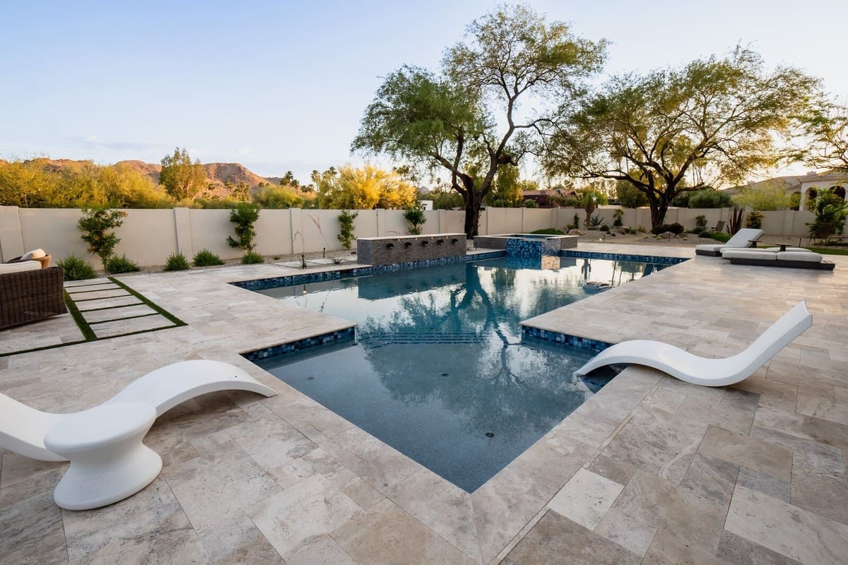 Pool with sleek, modern design as part of a home renovation in Phoenix, AZ by MGD Builders 