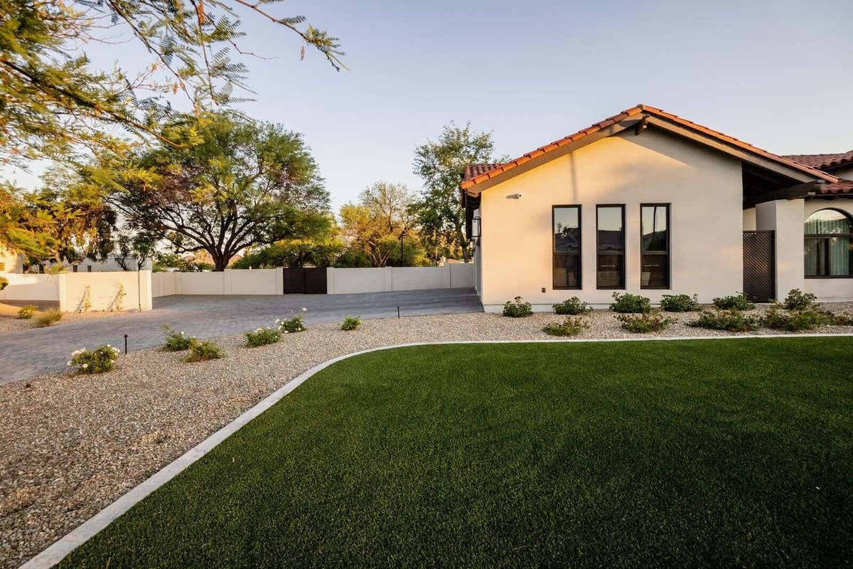 Side view of a modern home exterior in Phoenix, AZ, part of a whole home renovation by MGD Builders 