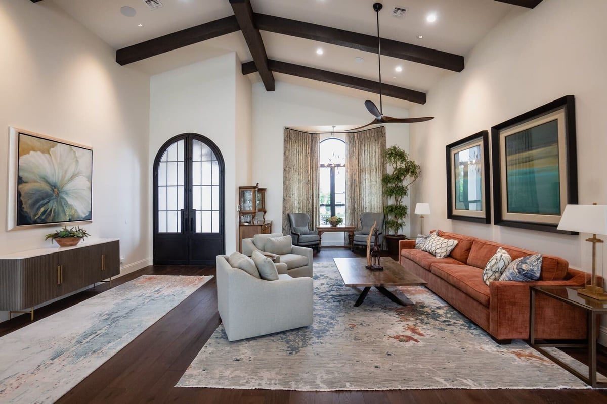 Spacious living room with vaulted ceiling, arched entryway, and modern decor, MGD Builders, Phoenix AZ 