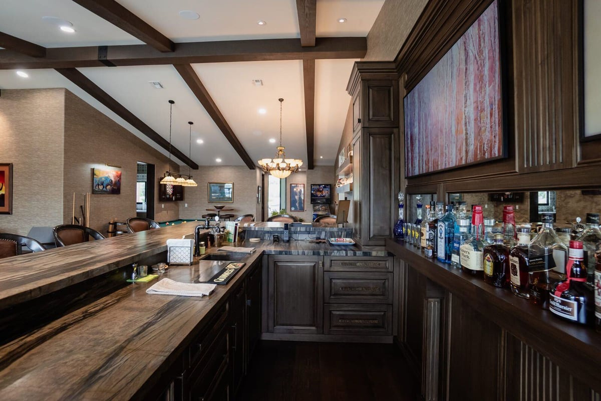 elegant custom home bar with wooden cabinets and alcohol in phoenix az custom home