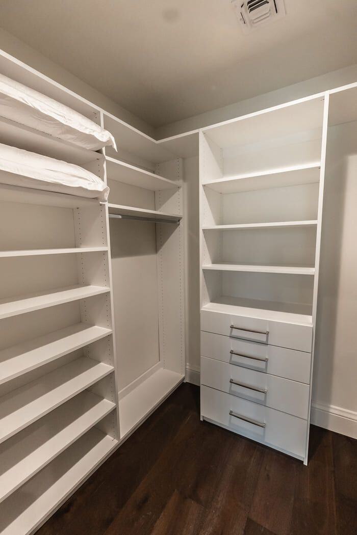 walk in closet with white shelving in phoenix az