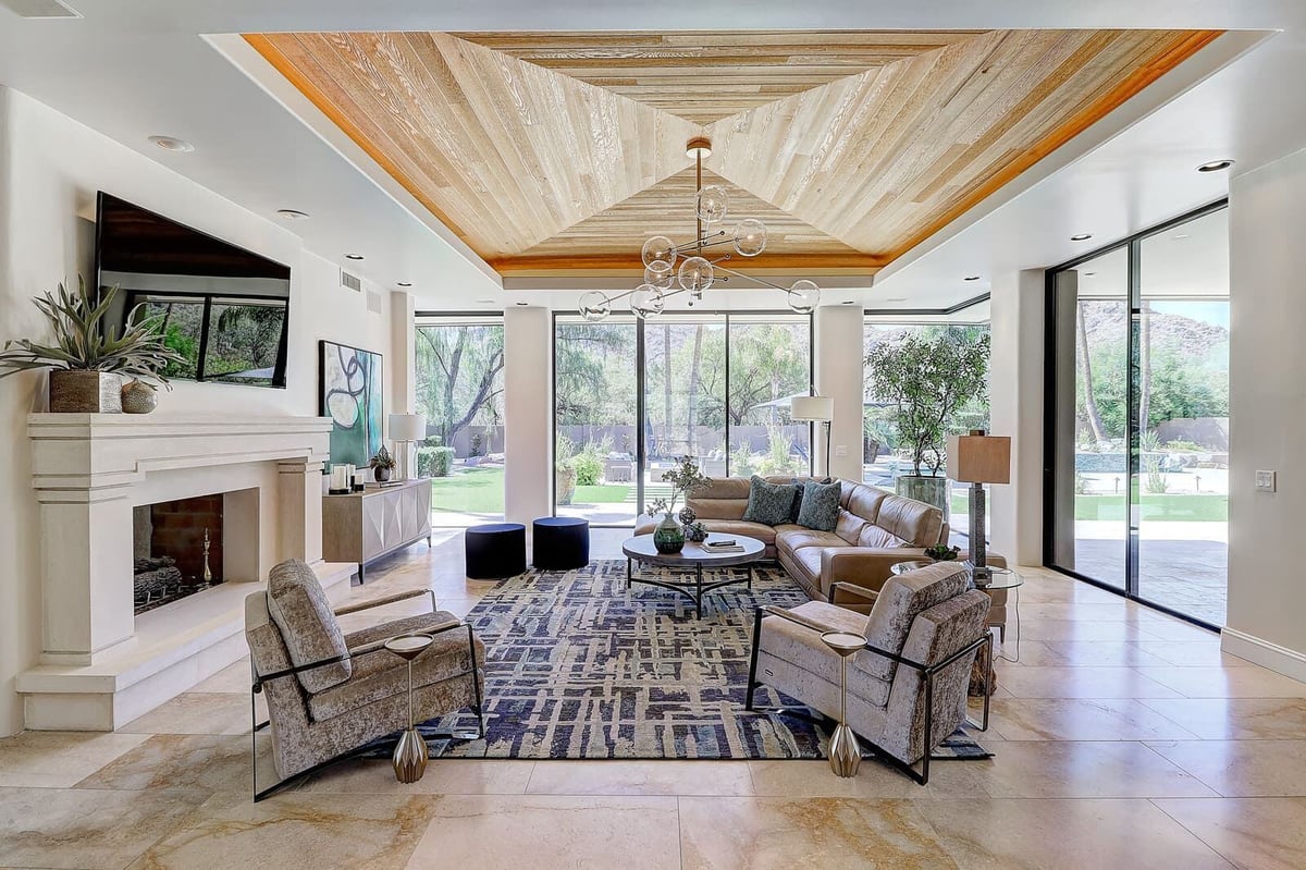 Bright living room with modern furnishings and large windows, part of MGD Builders whole home renovation in Paradise Valley, Phoenix, AZ 