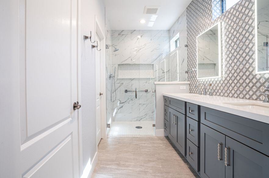 Gray and White Bathroom Remodel in Surprise Arizona with marble shower and double sink