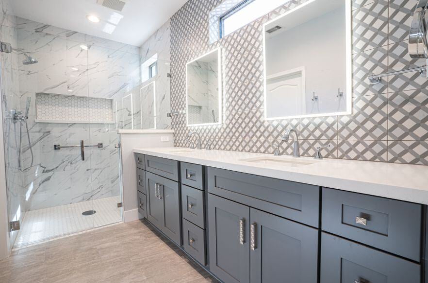 Gray Bathroom Cabinets and White Double Sink in Bathroom Remodel in Surprise, Arizona