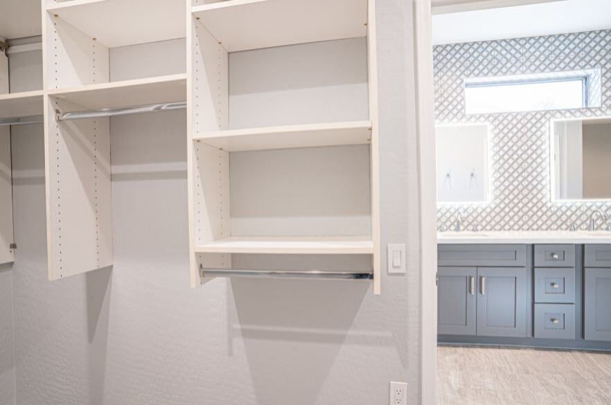 Functional Bathroom Closet shelving in remodeled bathroom