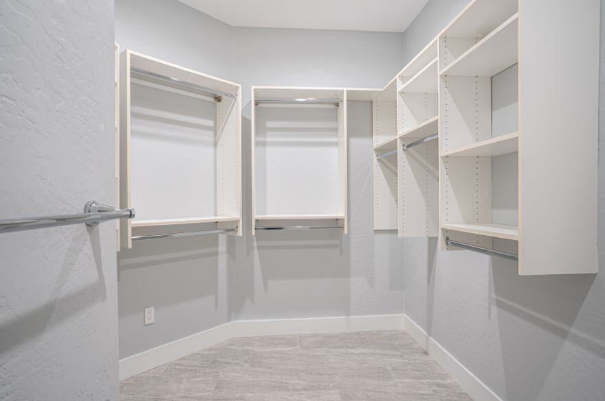 Bathroom Closet with functional shelving and towel bars