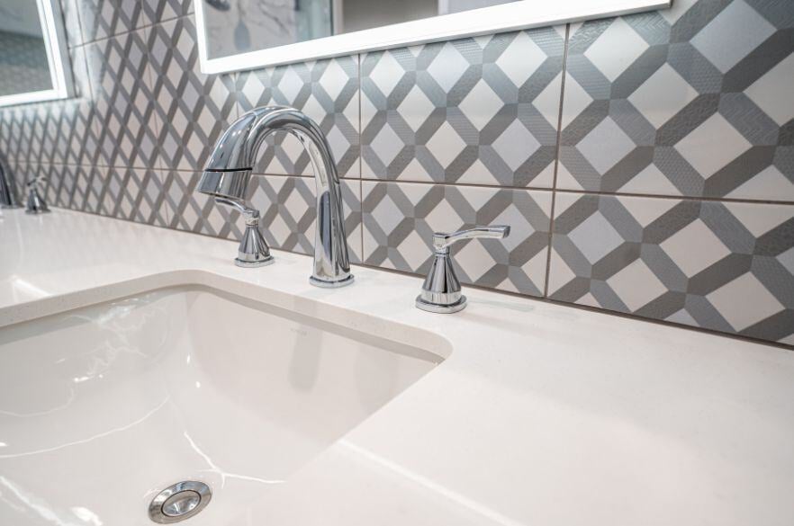 gray and white bathroom backsplash and white bathroom countertop