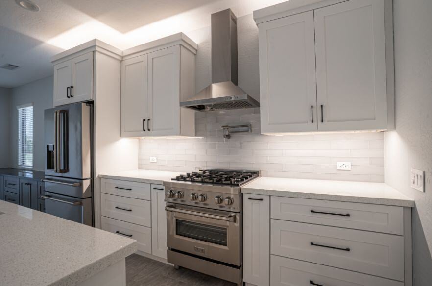 White Kitchen Remodel with stainless steel oven and white cabinets in Surprise, Arizona